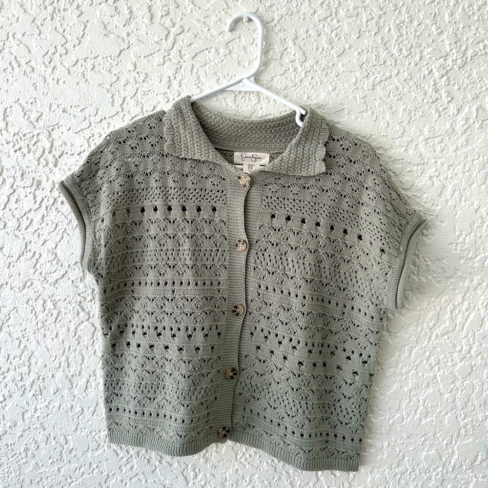 green knit top